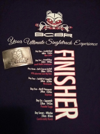 Race finisher's T-shirt and belt buckle